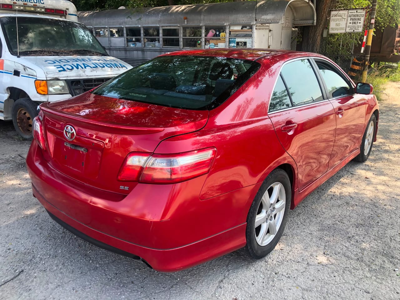 Red 2008 Toyota Camry dashboard view